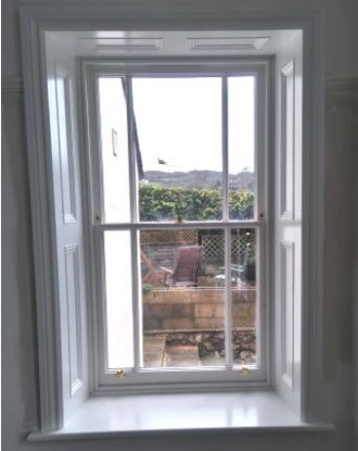 Bespoke Joinery From fitted shelving to matching in panelling around a window in a listed building