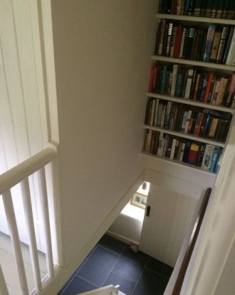 Bespoke Joinery From fitted shelving to matching in panelling around a window in a listed building